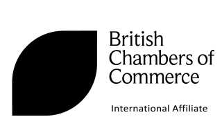 British Chambers of Commerce logo. Black Writing stating 'British Chambers of Commerce International Affiliate'. Black bold, filled in leaf shape. 